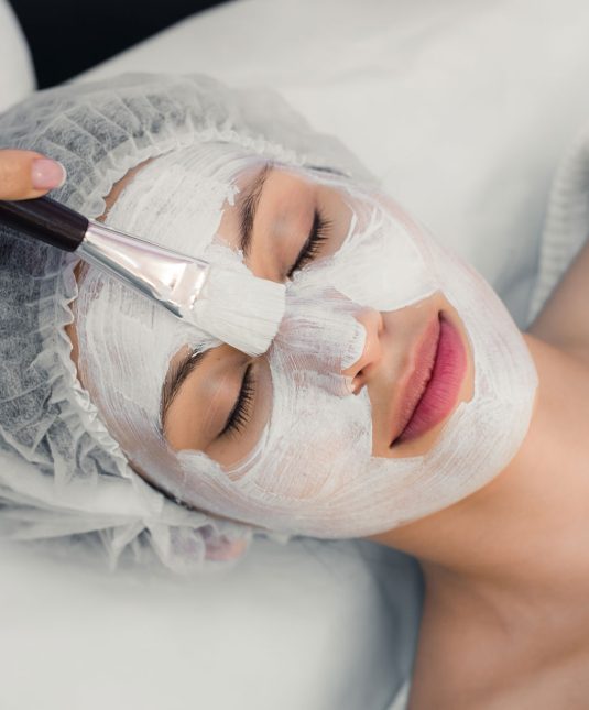 portrait-of-young-woman-while-facial-cosmetic-PGU9ZNZ.jpg