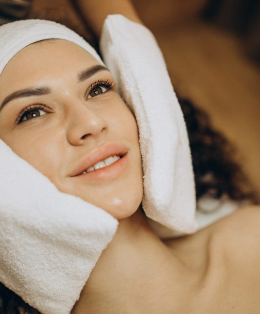 Woman at cosmetologist making beauty procedures